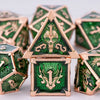 A set of seven green and gold metal dice shaped like houses with dragon motifs for tabletop role-playing games