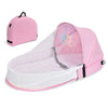 Pink portable foldable baby bed with a mosquito net and mattress shown from above.