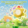 A yellow sunflower bubble blaster with LED lights is shown surrounded by dancing bubbles in a bright outdoor setting.