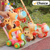 A bright orange and yellow kids bubble machine with giraffe figures and lights is shown outdoors.