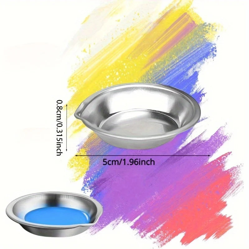 A stainless steel artist paint palette set showing a silver dish and vibrant paint strokes in yellow, blue, and pink.