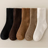 A row of women's fleece-lined slouch socks in various earth tones including black, brown, olive, and cream.