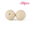 Two round, beige silicone beads are shown against a white background.