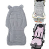 Gray plush double-sided stroller seat cushion with pink padding shown separately and installed in a stroller.