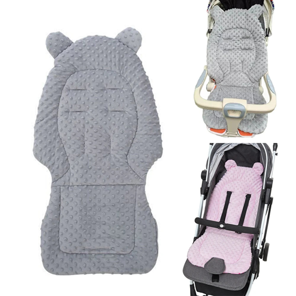 Gray plush double-sided stroller seat cushion with pink padding shown separately and installed in a stroller.