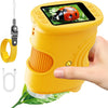 A yellow portable digital microscope for kids is shown holding a green leaf.
