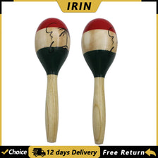 A pair of hand-painted wooden maracas with natural wood handles and red tops.