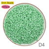A pile of 5mm green beads, labeled as D4 size, for crafting and pixel art projects.