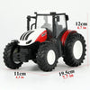 A white and red remote control tractor model with large tires and a cab is shown.
