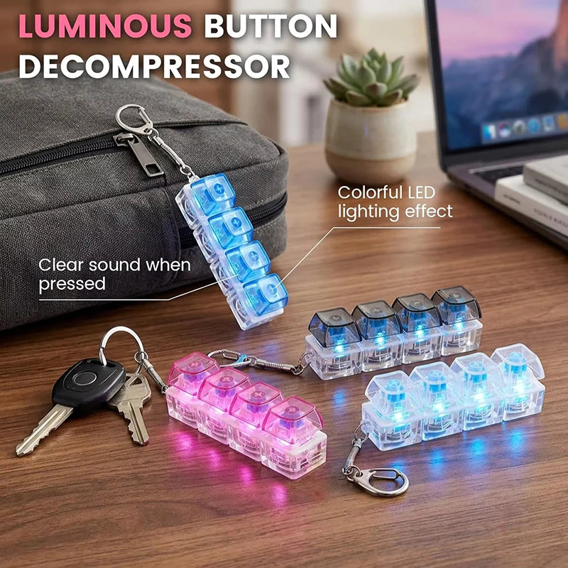 A collection of luminous button decompressors in various colors and sizes displayed on a wooden surface.