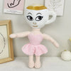 A white and gold plush toy shaped like a mug with a face, standing in front of framed text.