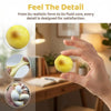 A hand holds a yellow fluid potato squishy toy, showing its realistic form and detail.