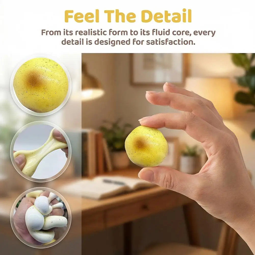 A hand holds a yellow fluid potato squishy toy, showing its realistic form and detail.