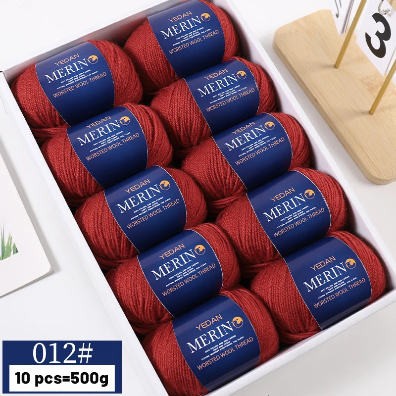 A box containing 10 balls of YEDAN MERINO worsted wool thread yarn in a reddish-brown color.