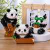 A set of mini panda building blocks featuring black and white panda figures displayed in a wooden frame.