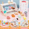 A wooden ice cream counter play set with various ice cream molds and accessories for children