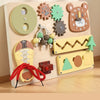 A wooden busy board for children featuring various musical and sensory activities like a bear clock, gears, and a shoe.