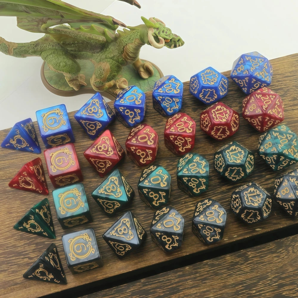 A set of polyhedral dice featuring dragon-inspired designs in various shades of blue, green, and red.
