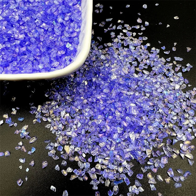 A pile of crushed blue and purple glass crystals for resin and jewelry making