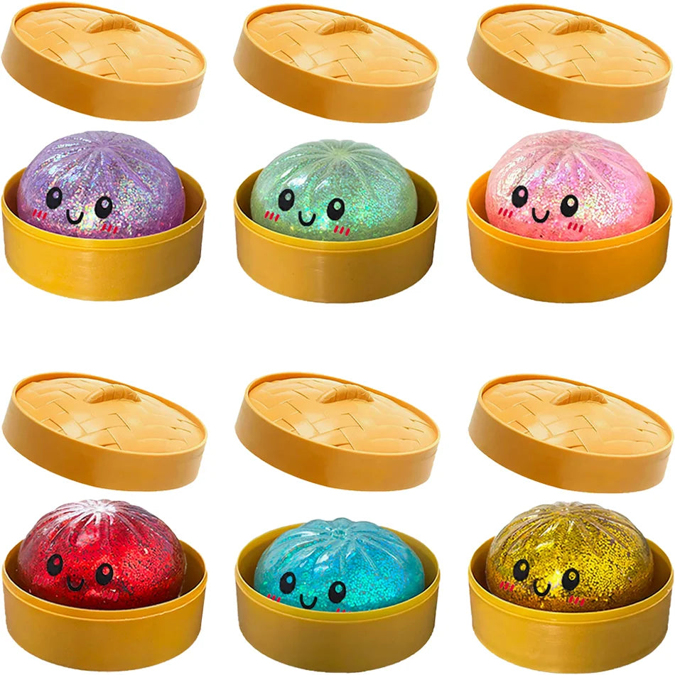 A set of yellow containers holding various glitter-filled squishy toys shaped like dumplings.