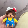 A plush monkey charm pendant with brown fur, yellow shirt, blue overalls, and a white and red headband.