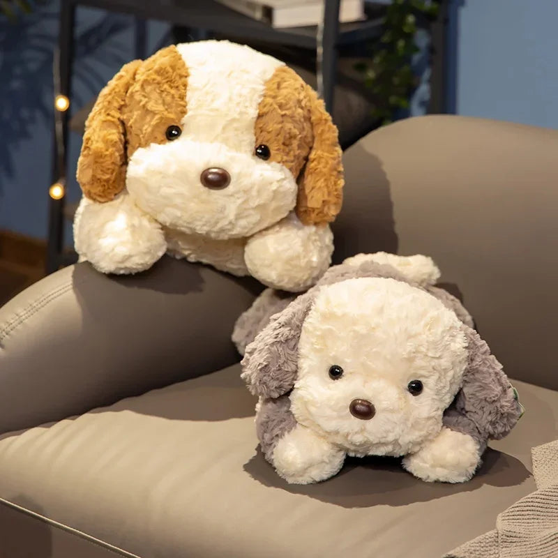 A plush toy of a dog with brown and white fur is lying on a beige sofa cushion.