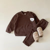 A brown baby long sleeve cartoon top and pants set with a white bear graphic