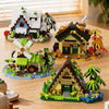 A collection of miniature wooden building sets featuring a cabin, windmill, and other woodland scenes.