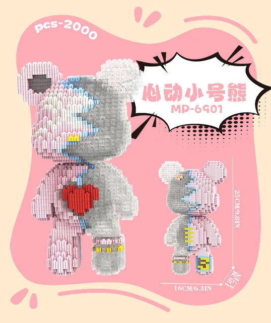 A pink brick art bear figure made of building blocks with a heart detail and yellow accents.