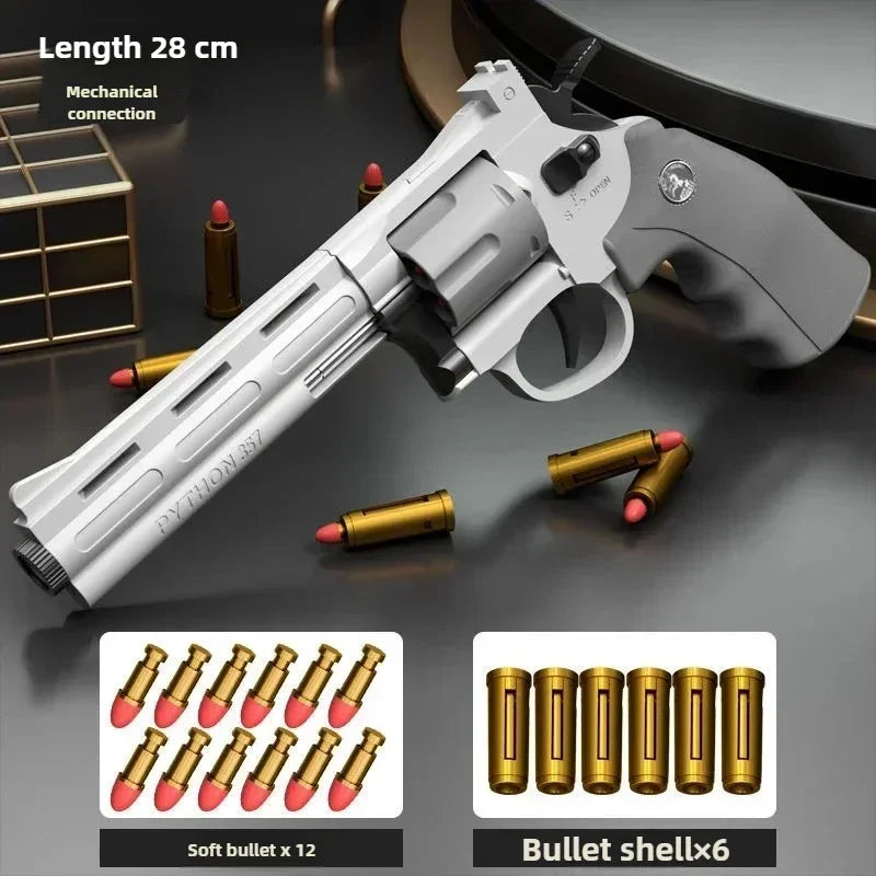A silver pistol is shown next to soft bullet and bullet shells for a dart blaster product.