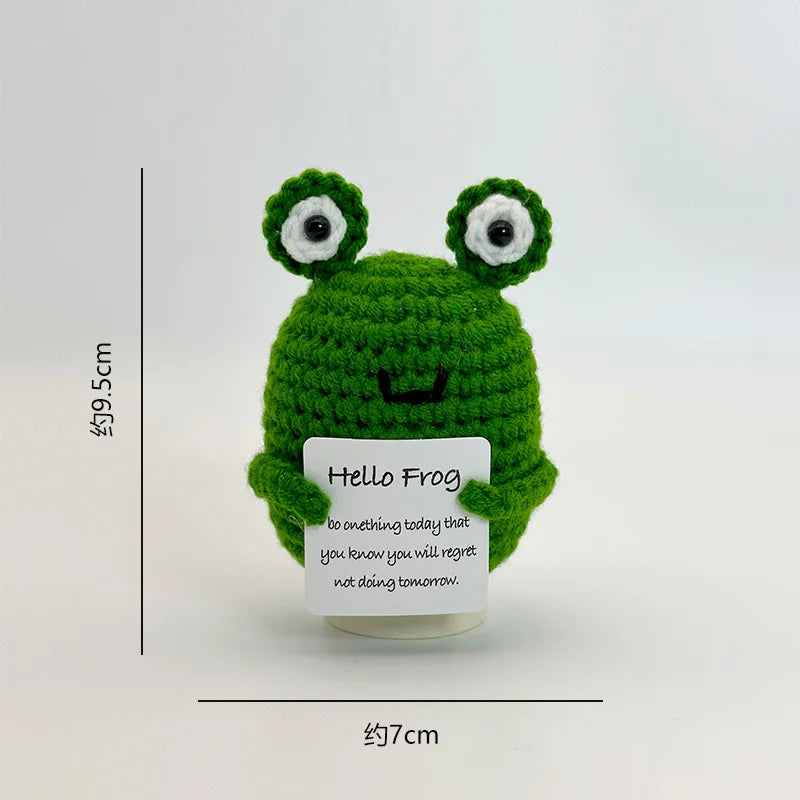 A handwoven crochet frog desk decor featuring bright green body and large eyes.