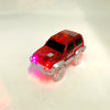 A red race track car toy with glowing LED lights and a silver chassis.