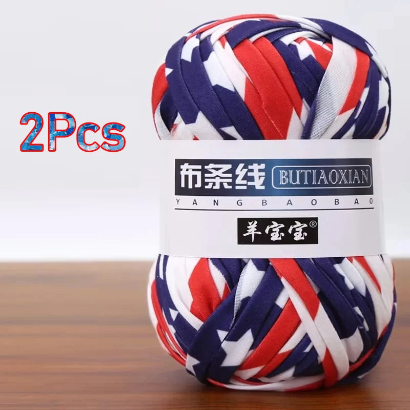 Two skeins of red, white, and blue striped soft chunky yarn for crochet and knitting