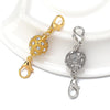 Gold and silver magnetic clasps for jewelry making displayed on a white surface.
