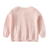 A light pink knitted cotton cardigan sweater with a textured stitch pattern.
