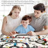 A father and son play with a Kids City Road Map Play Mat featuring various vehicles on a street layout.