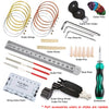 A collection of guitar repair tools including strings, bones, pins, files, and a steel ruler.