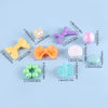 A collection of colorful acrylic beads and components for DIY jewelry making including various shapes and sizes.