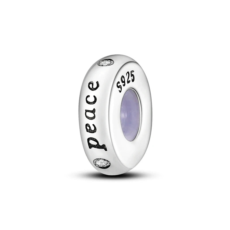 A silver charm bead engraved with the word peace and the number 925 for DIY bracelet making.