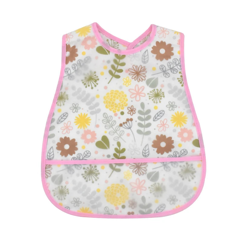 A white baby bib with a floral and leaf pattern featuring pink trim.