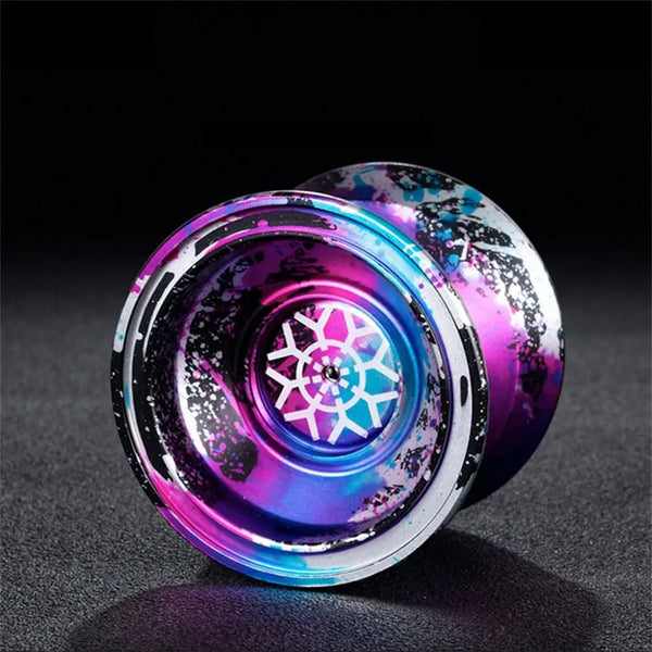Close-up of a high-performance aluminum yoyo with 10 ball bearings featuring a vibrant purple and blue iridescent finish.