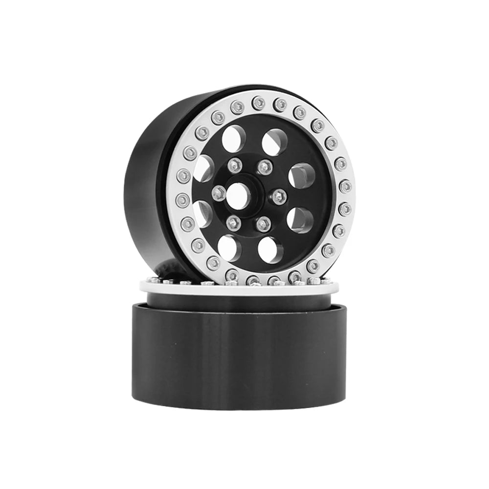 Black metal beadlock wheels for an RC crawler with a removable hex hub.