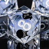 A clear resin die with a diamond cut featuring a black cat silhouette and an infinity symbol.