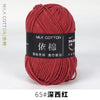 A skein of deep crimson milk cotton yarn labeled with Chinese characters and the designation 65# Deep Burgundy.