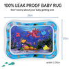 A clear baby rug with colorful sea creatures and plants for tummy time