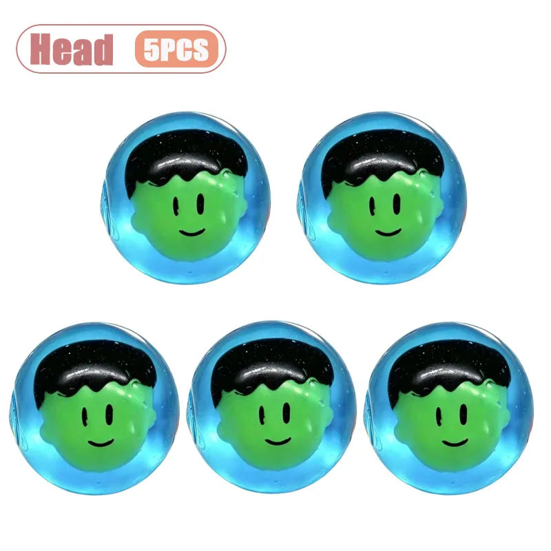 Five black and green pumpkin head squishy stress relief toys