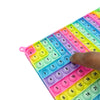 A colorful plastic fidget toy board with numbered tiles for multiplication and addition practice.