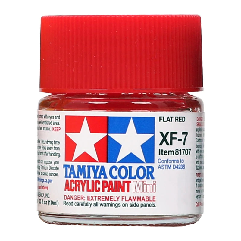 A bottle of Tamiya Color Acrylic Paint Mini in flat red color with a red cap.