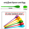 A set of six colored spoons and eggs for a game, showing various colors arranged in a fan shape.