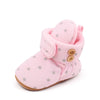 Pink baby winter snow boots with fuzzy ball accents